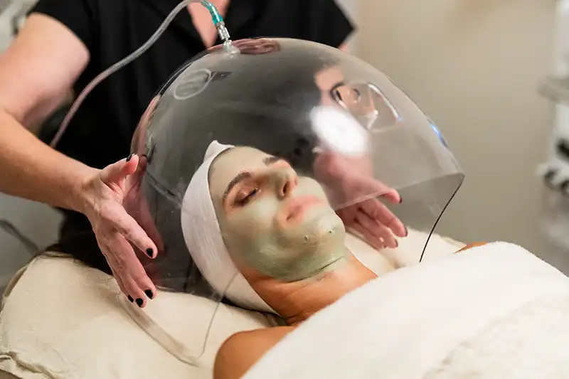 A woman receives an Oxygen Facial at a facial spa near Northwest Dallas, Texas.
