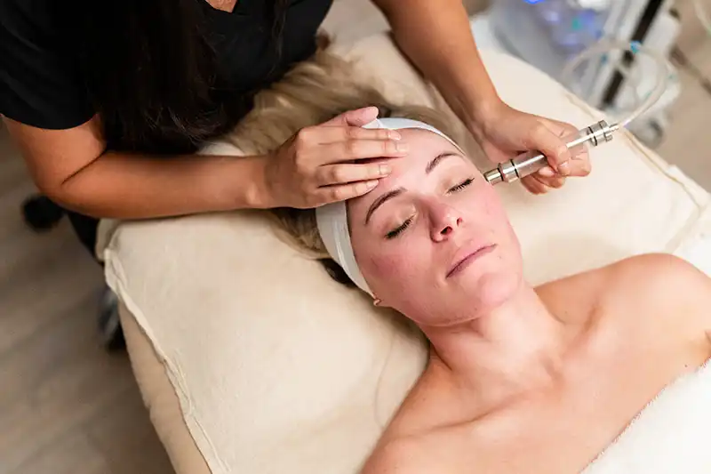 A woman receives nanoneedling treatment at a facial spa near Dallas, Texas.